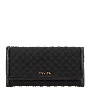 Prada quilted long wallet in black nylon and leather for women.